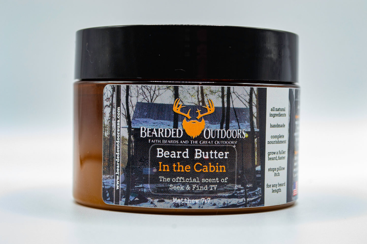 Jar of beard butter labeled 'Beard Butter In the Cabin' by Bearded Outdoors on a white background